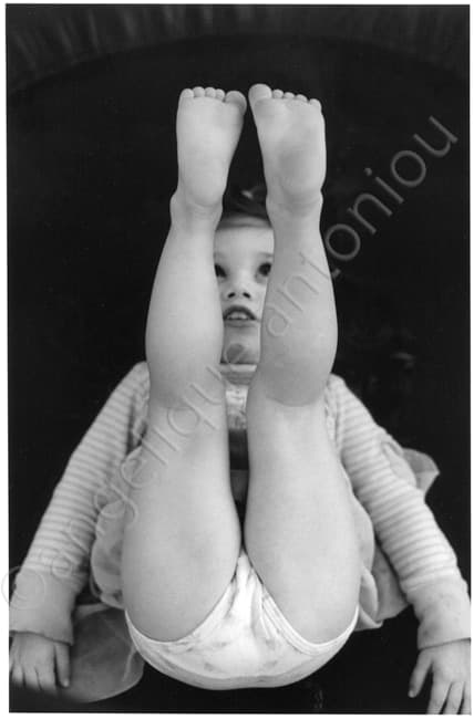 Black and white children photograph titled My Feet by Angelique Antoniou