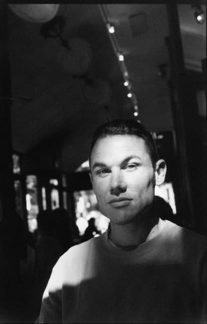 Black and white people photograph titled NY Cafe by Angelique Antoniou
