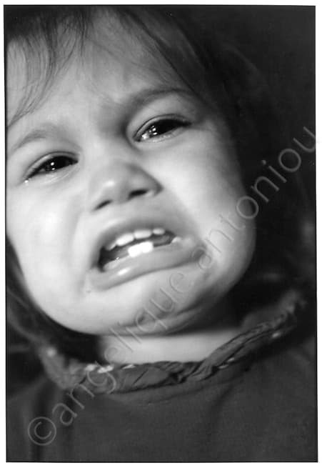 Black and white children photograph titled The Cry by Angelique Antoniou