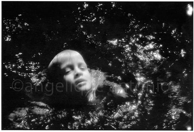 Black and white children photograph titled Alive by Angelique Antoniou