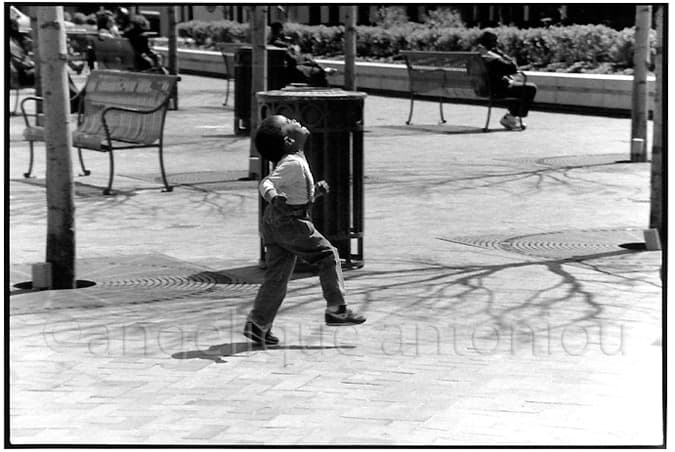Black and white children photograph titled The Joy of Skipping by Angelique Antoniou